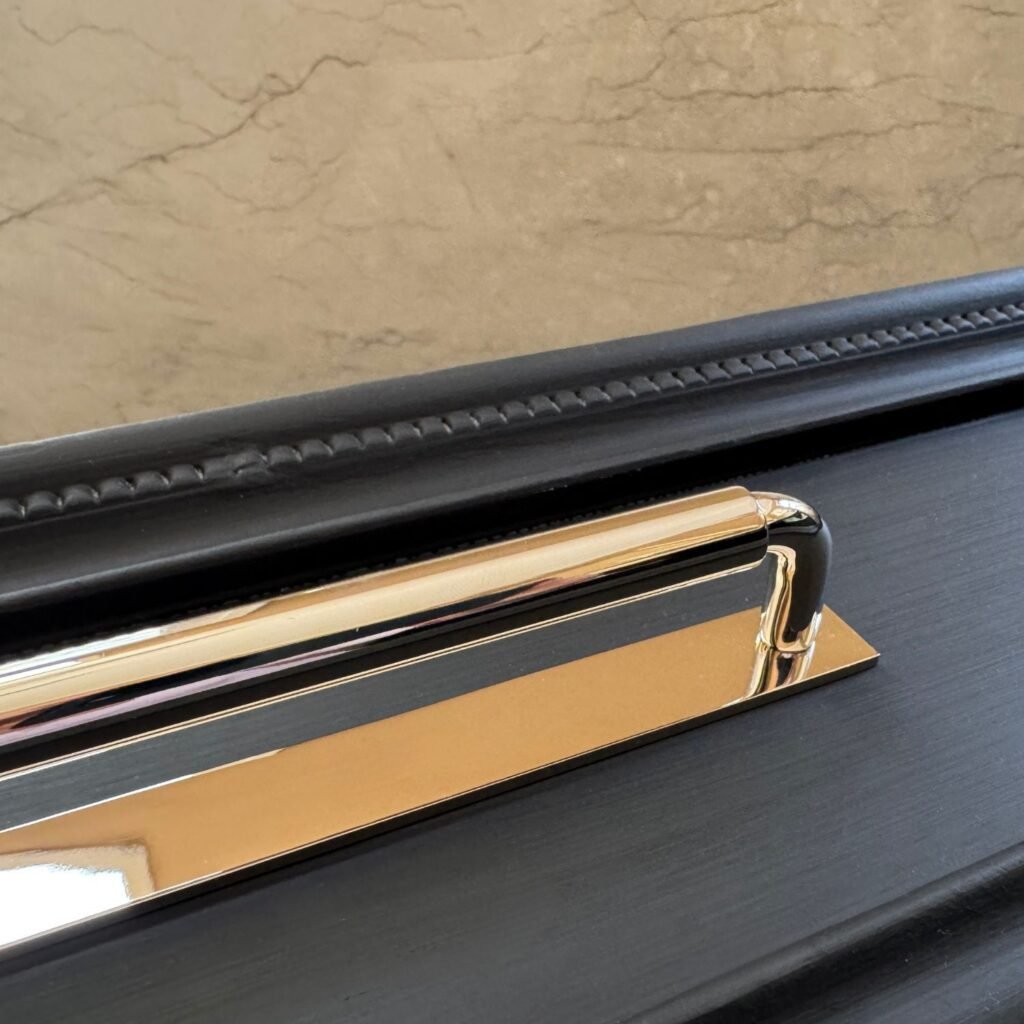 Polished Nickel Pull and Backplate on matte black vanity 