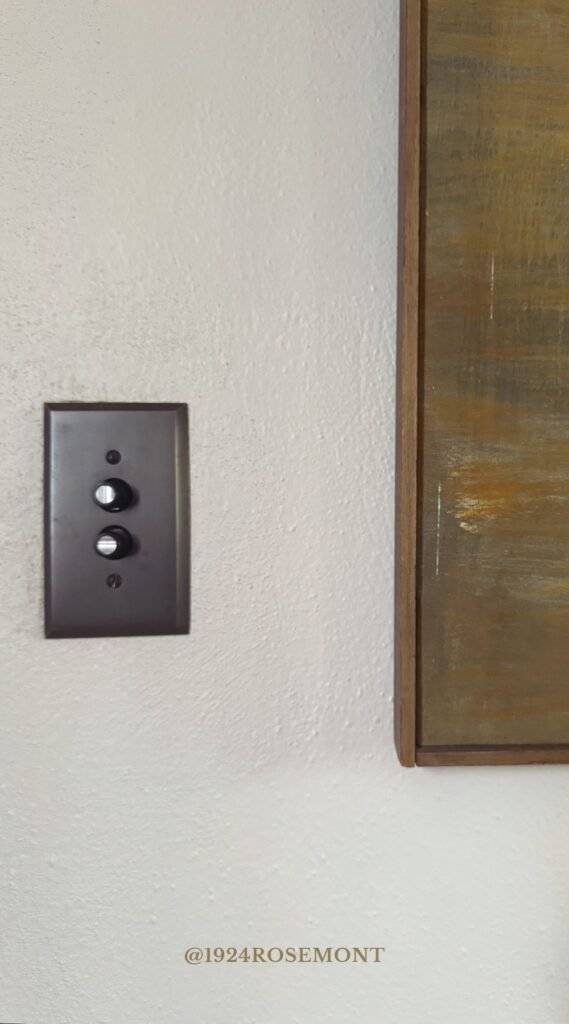 House of Hardware Dimmer Pushbutton light switch with mother of pearl buttons and cast brass switch cover with bronze finish