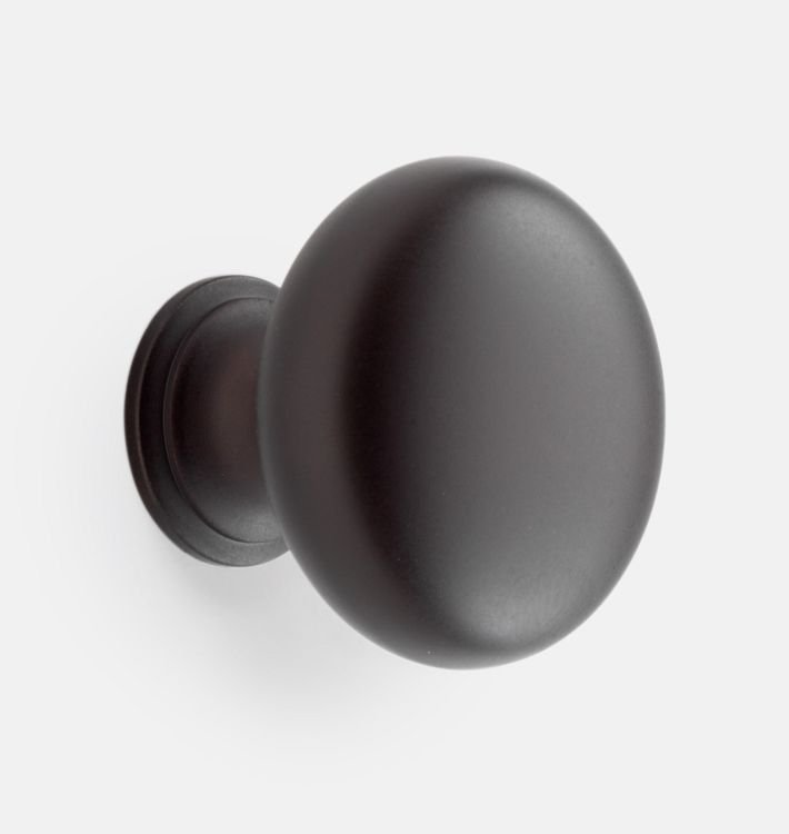 The Massey Round Cabinet Knob Oil in Rubbed Bronze from Rejuvenation - what we have in the laundry room