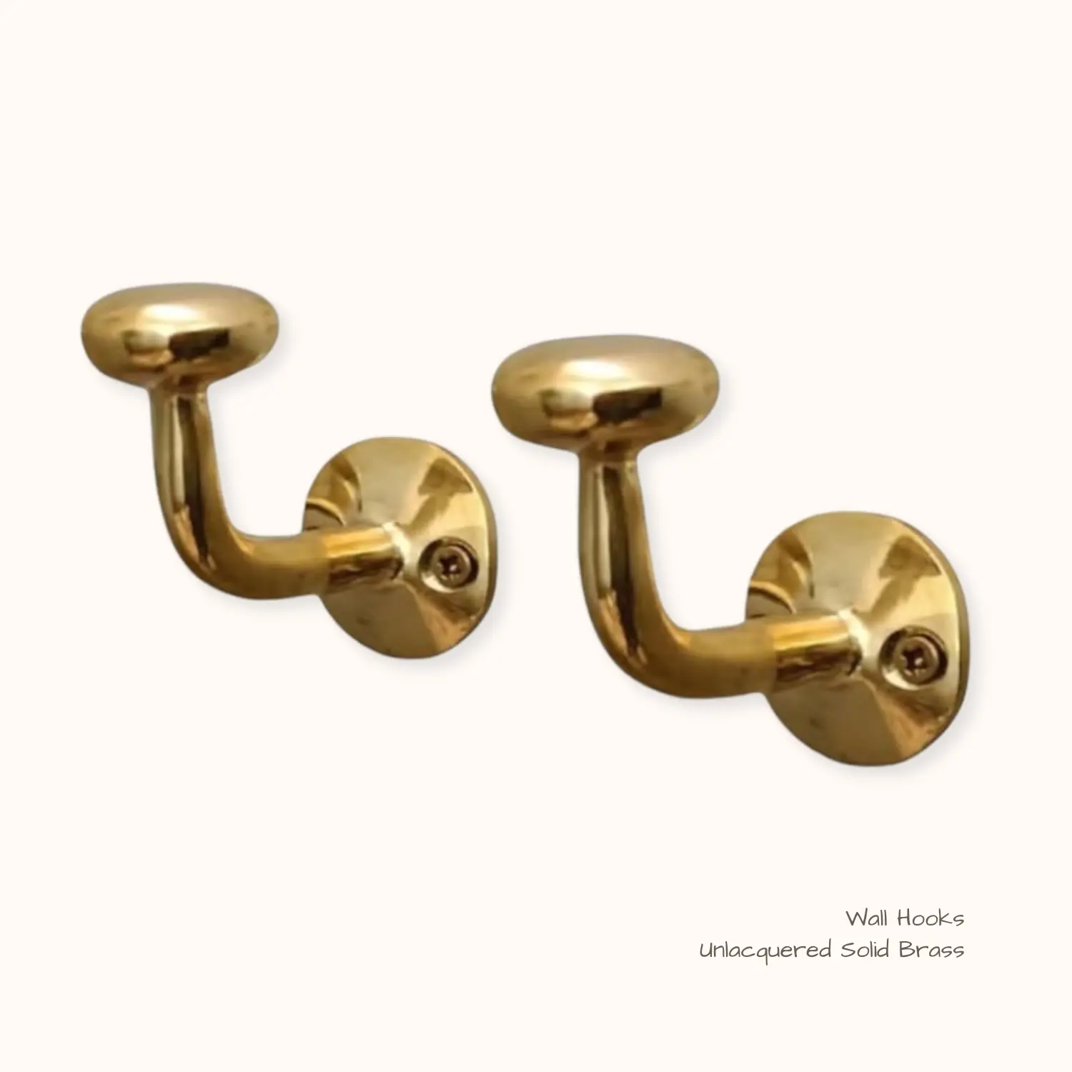 Solid unlacquered brass wall hooks that patina over time